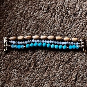 This is an Apple Watch band with Blue and Brown Accents